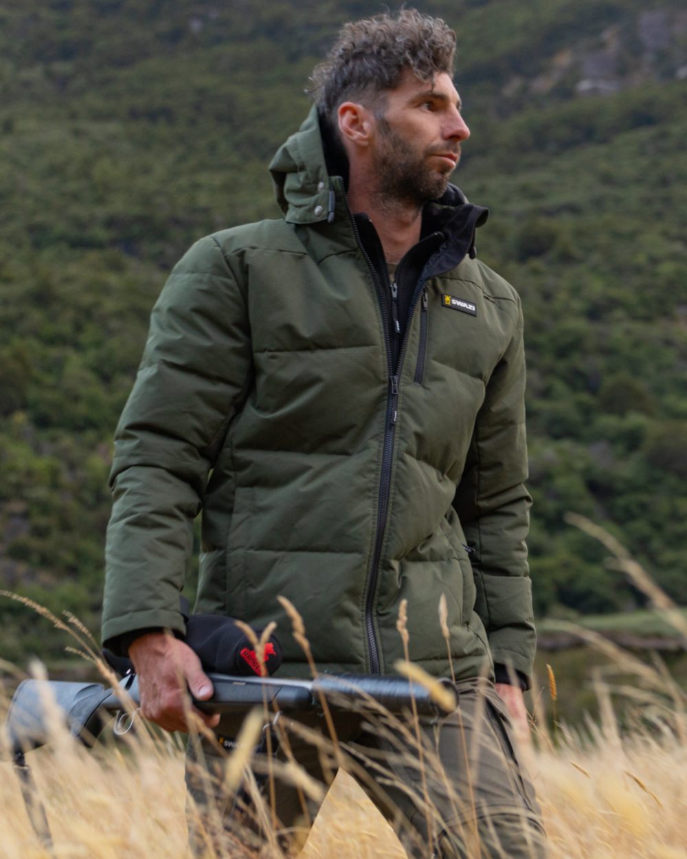 Olive coloured Swazi Mens Jack Frost Insulation Jacket on forest background