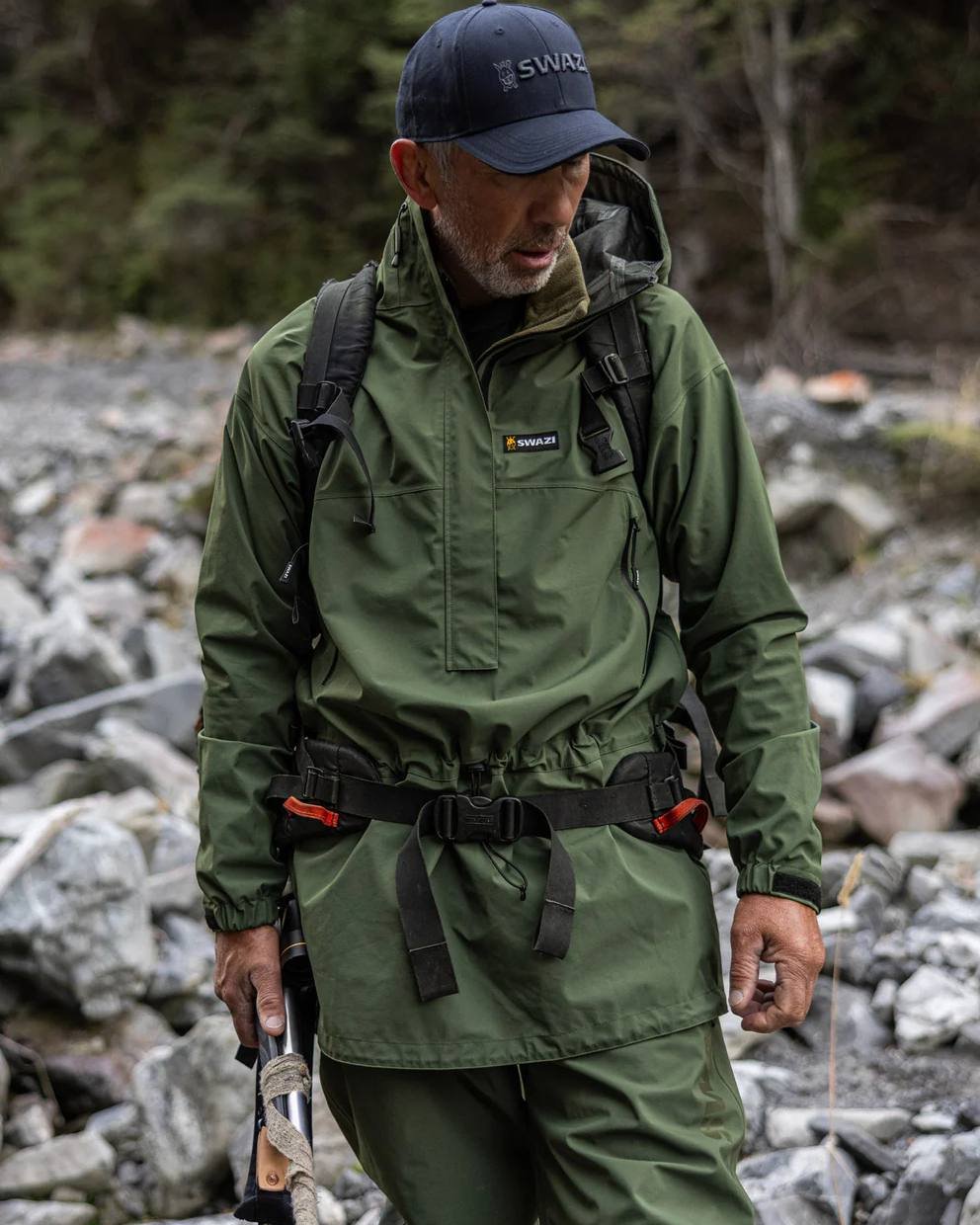 Olive coloured Mens Swazi Mens Tahr Ultralite Jacket on rock background