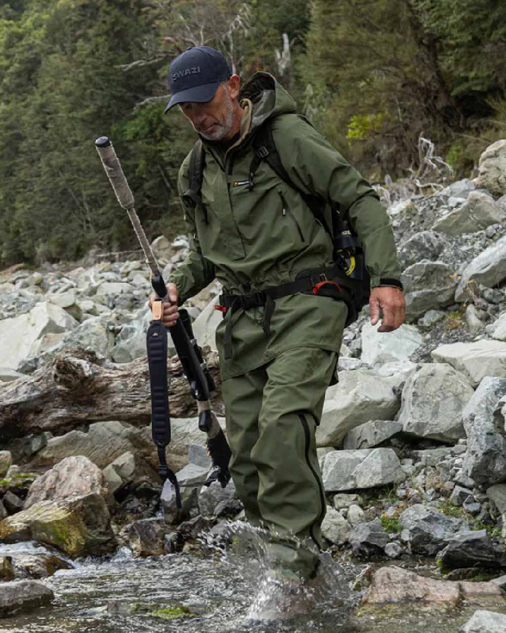 Olive coloured Mens Swazi Mens Tahr Ultralite Jacket on rock background