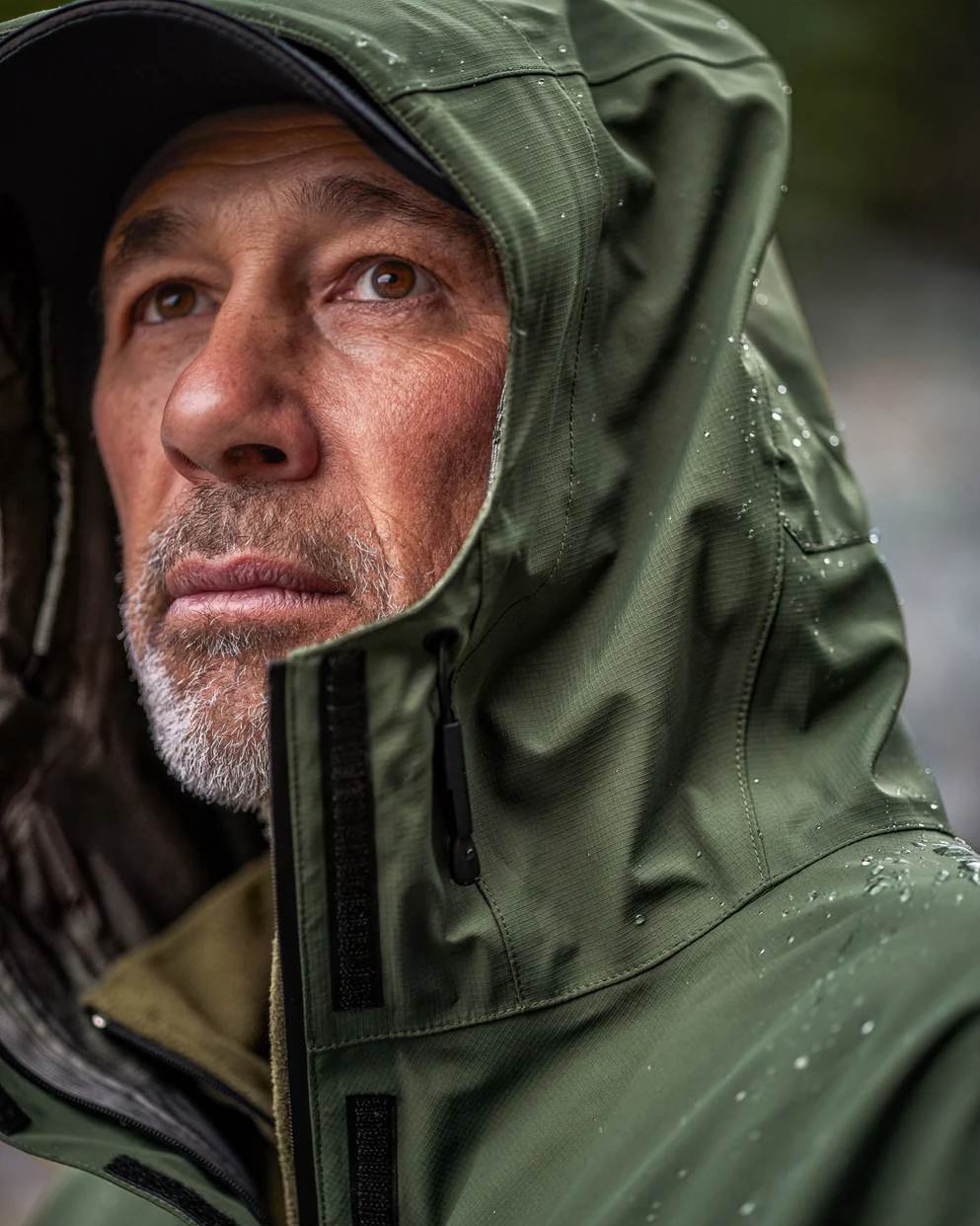 Olive coloured Mens Swazi Mens Tahr Ultralite Jacket on sky background