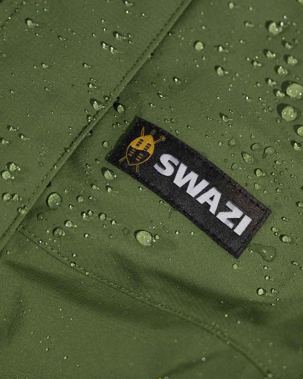 Olive coloured Mens Swazi Mens Tahr Ultralite Jacket on white background