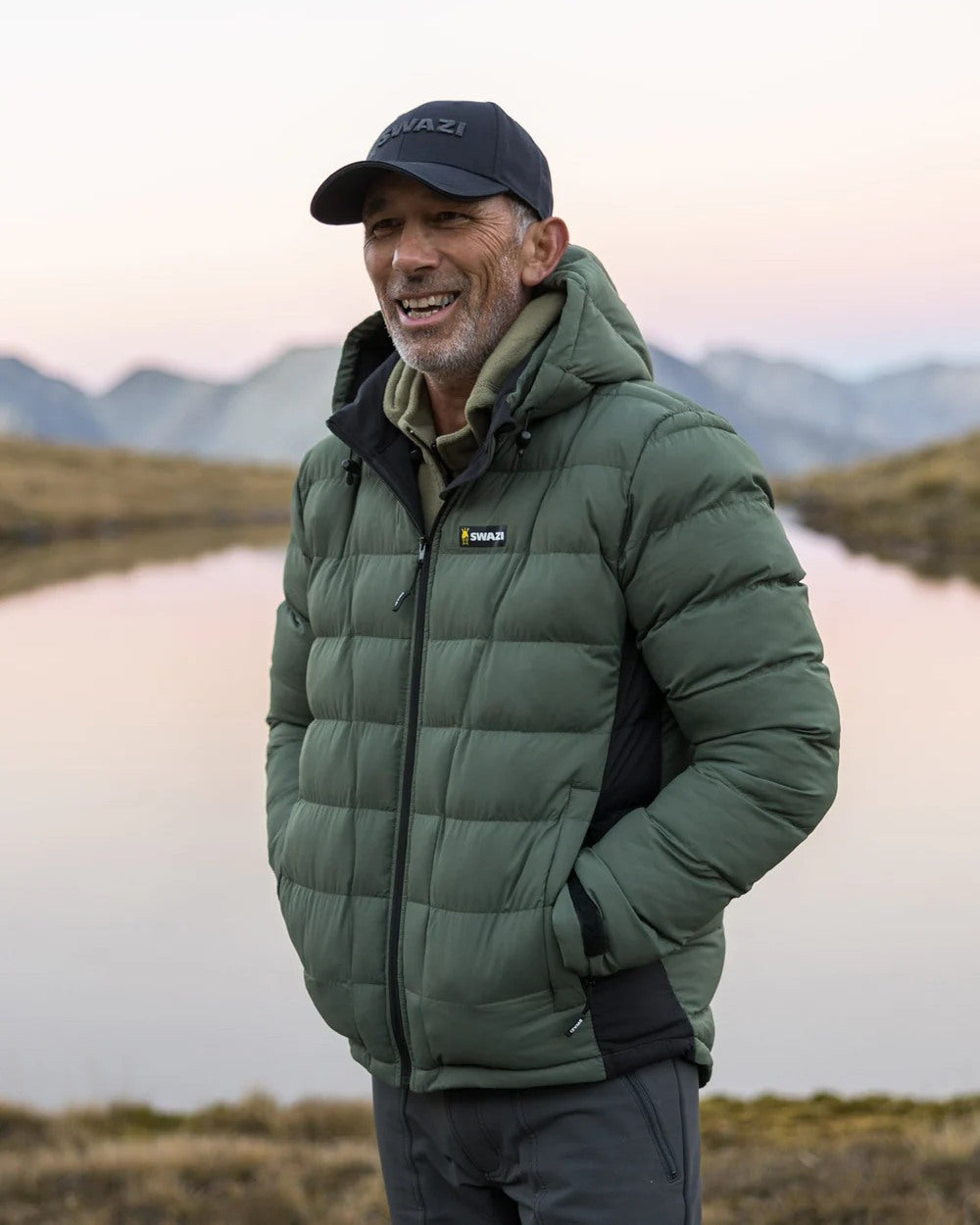 Olive coloured Swazi Puffadder Jacket on blurry background