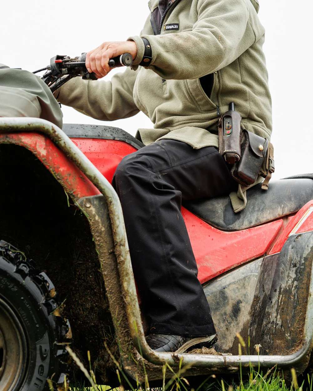 Black Coloured Swazi Torrent Overpants on tractor background