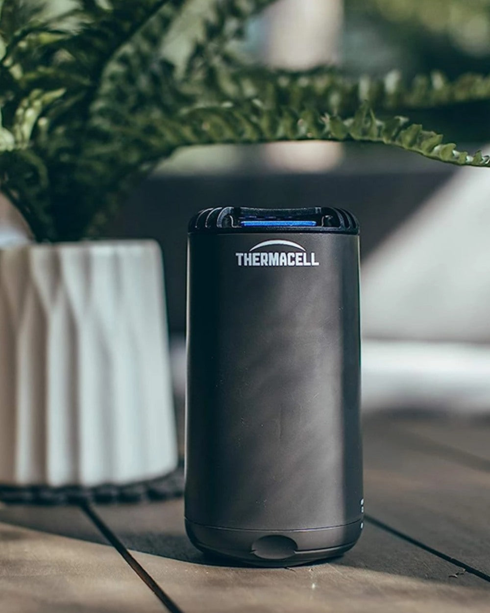 Graphite coloured Thermacell Halo Mini Protector on blurry background