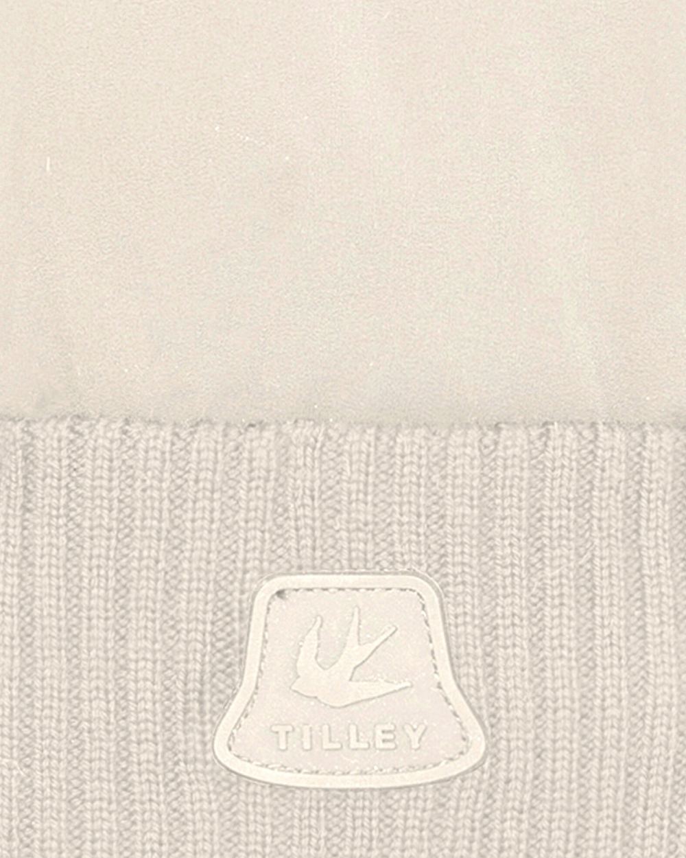 Off White coloured Tilley Airlite Down Padded Beanie on white background