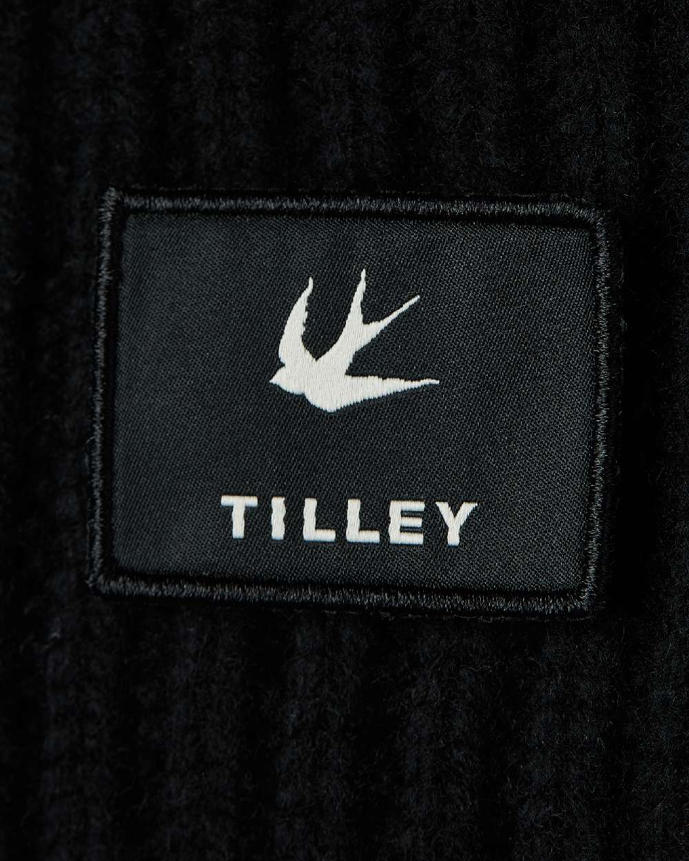 Black Coloured Tilley Alpine Beanie on white background