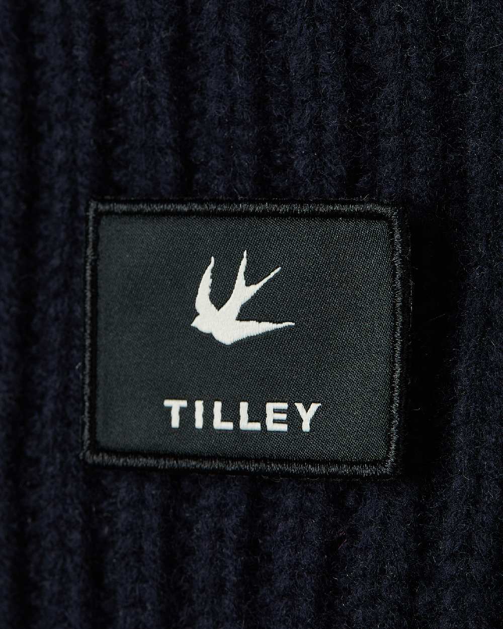 Navy Coloured Tilley Alpine Beanie on white background