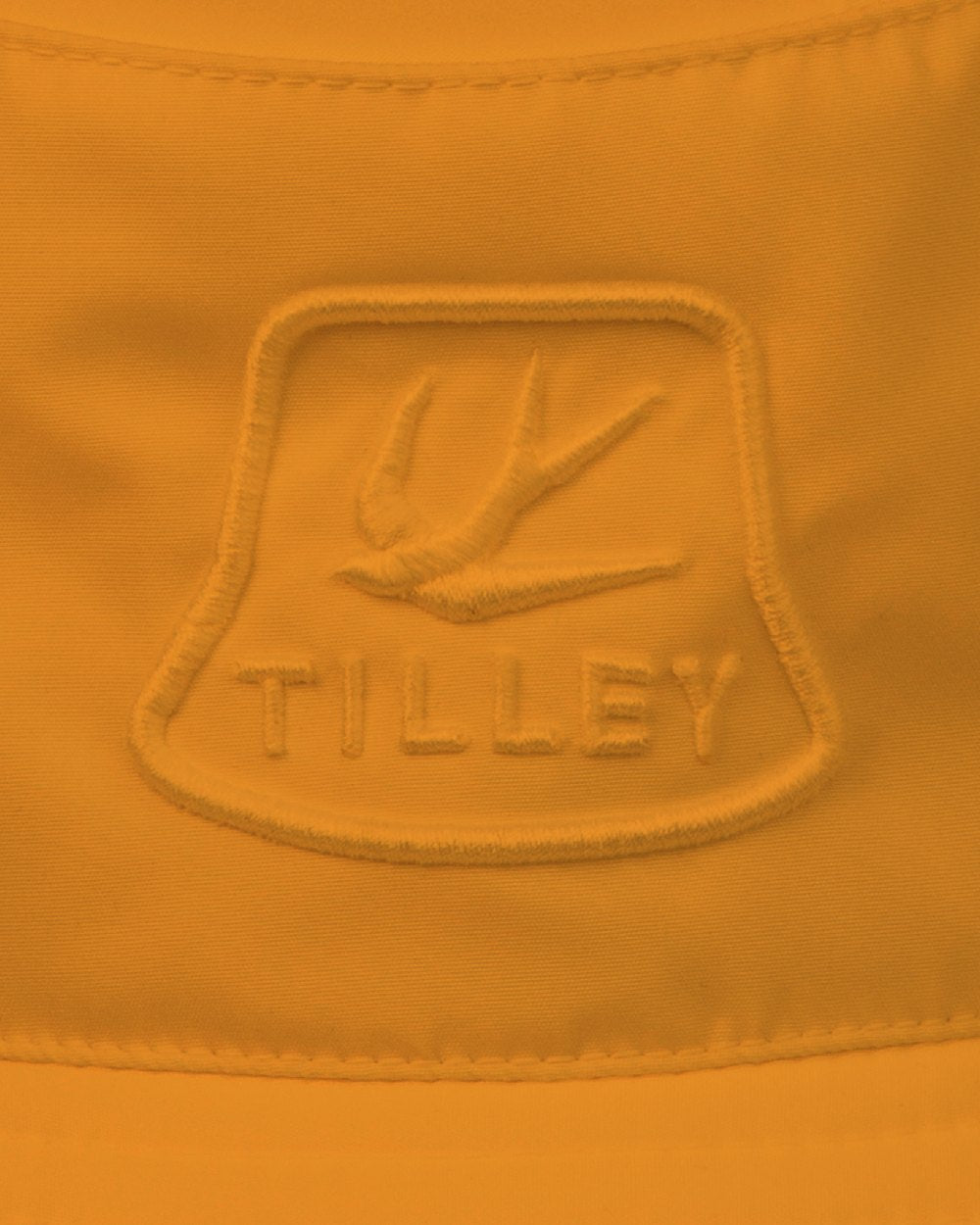 Orange Coloured Tilley T1 Performance Bucket Hat on white background