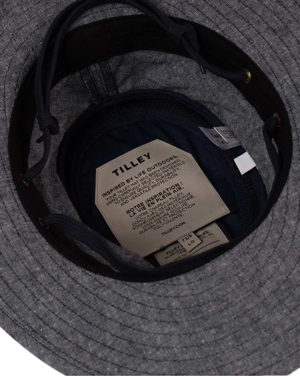 Navy Coloured Tilley TMH55 Organic Airflo Sun Hat on white background