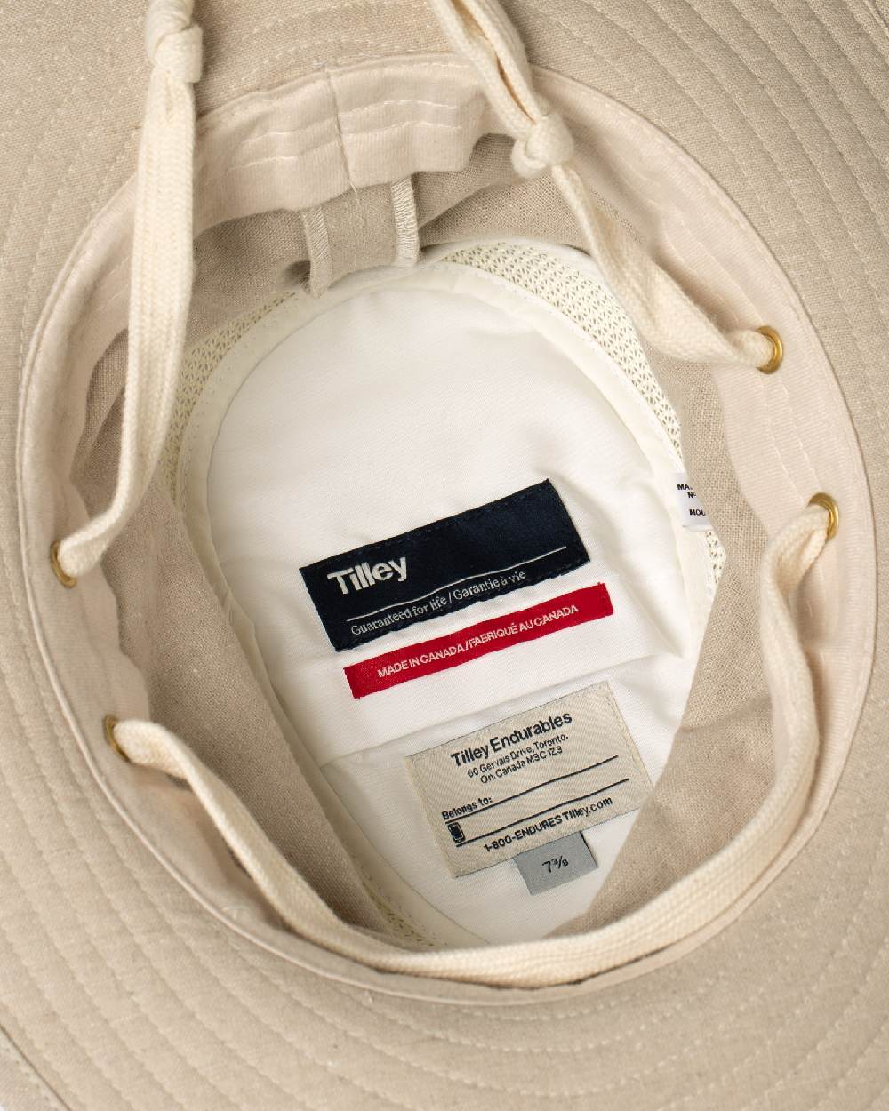 Sand Coloured Tilley TMH55 Organic Airflo Sun Hat on white background
