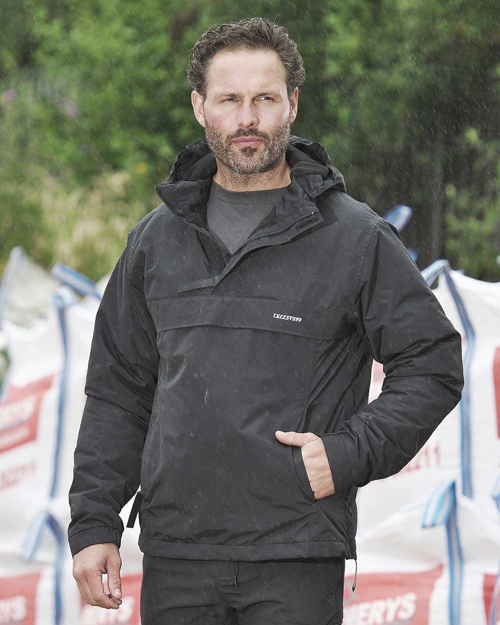 Black Coloured TuffStuff Sutherland Waterproof Windbreaker Smock On A Street Background