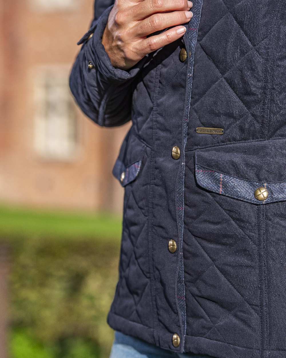 Dark Navy Blue Coloured Baleno Halifax Ladies Quilted Jacket on blurry background