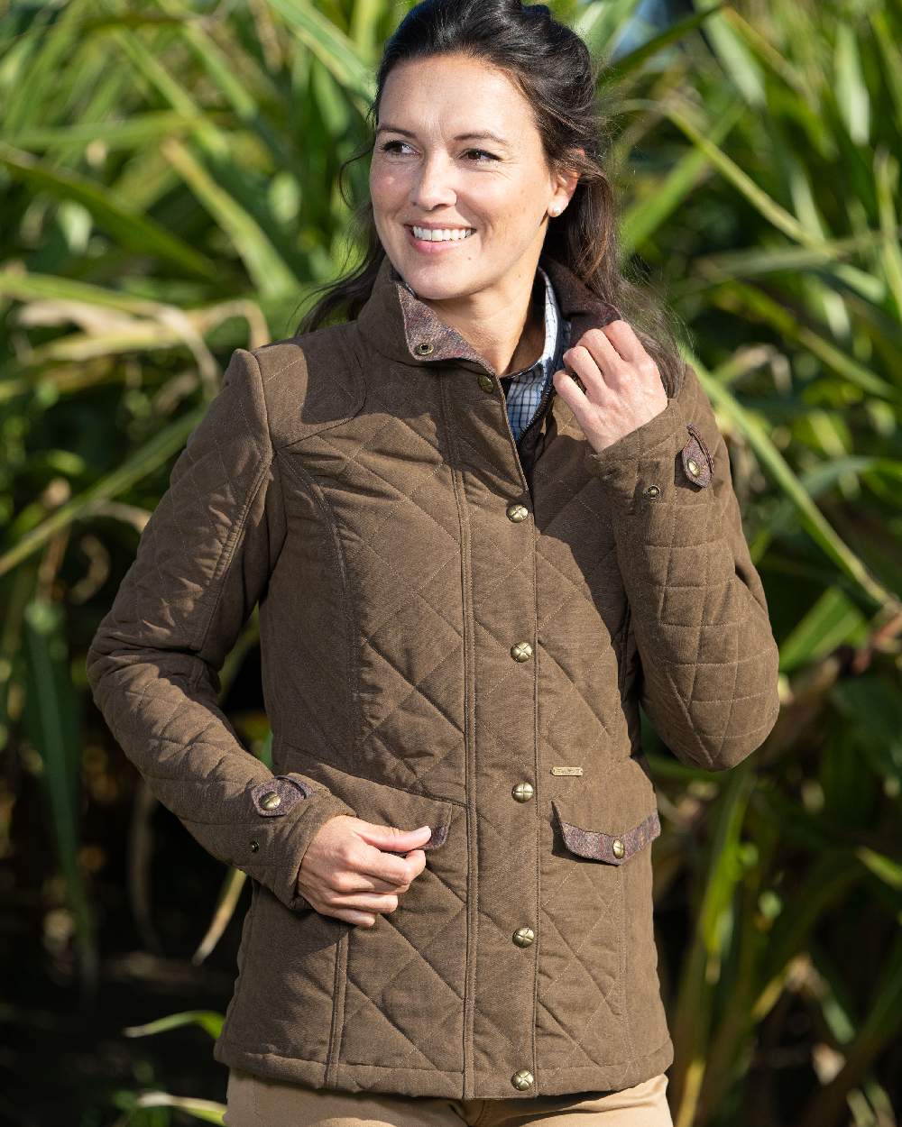 Earth Brown Coloured Baleno Halifax Ladies Quilted Jacket on grass background