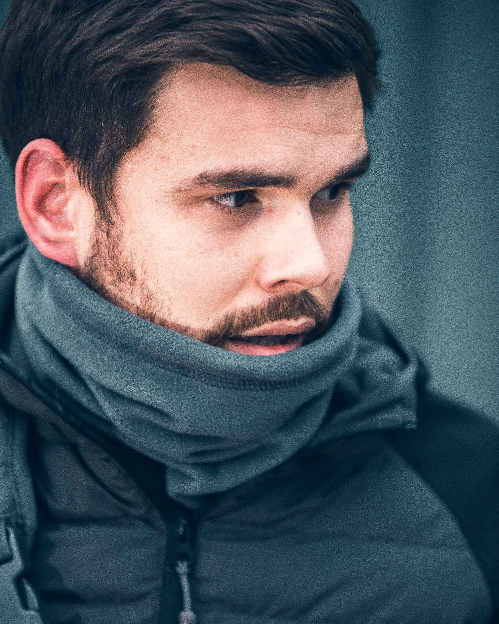 Titanium Coloured Viper Tactical Neck Gaiter on curtain background