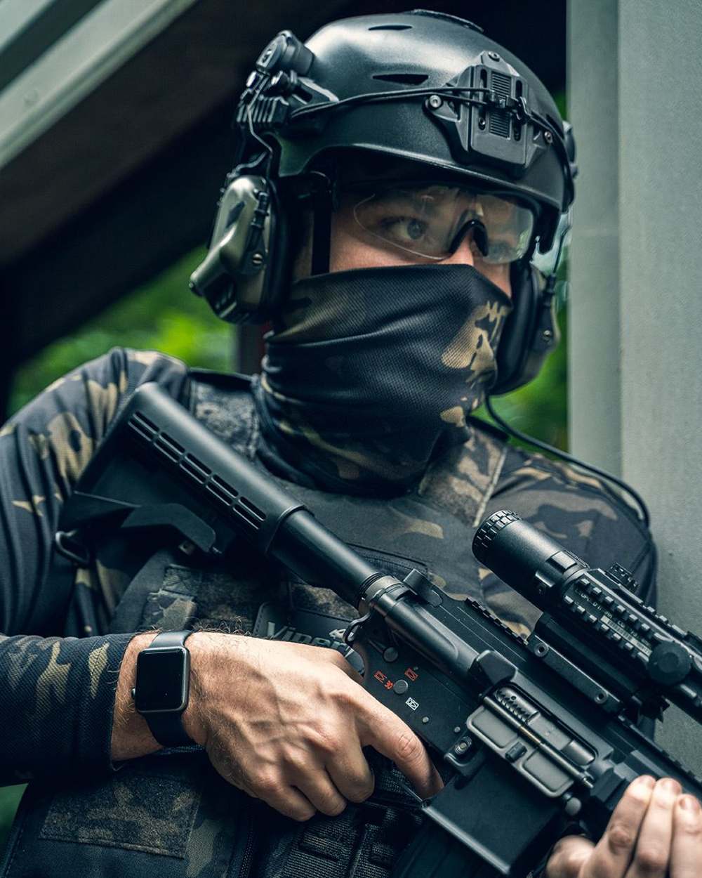 VCAM Black Coloured Viper Tactical Roll Neck Top on blurry background