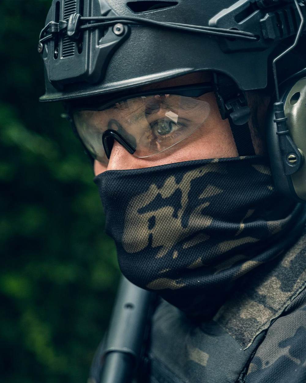 VCAM Black Coloured Viper Tactical Roll Neck Top on blurry background