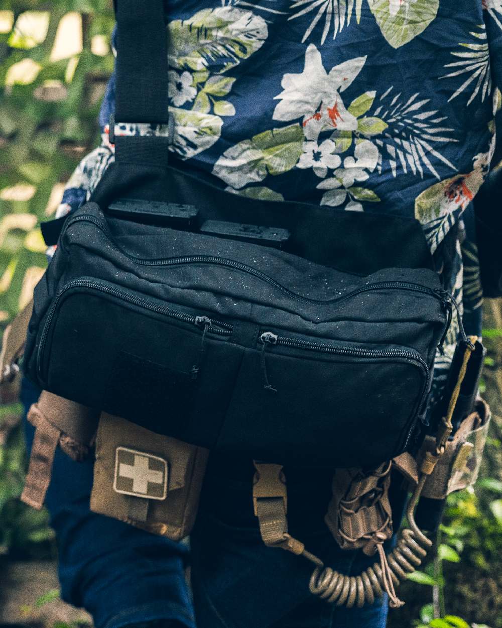 Black Coloured Viper VX Buckle Up Sling Pack on blurry background