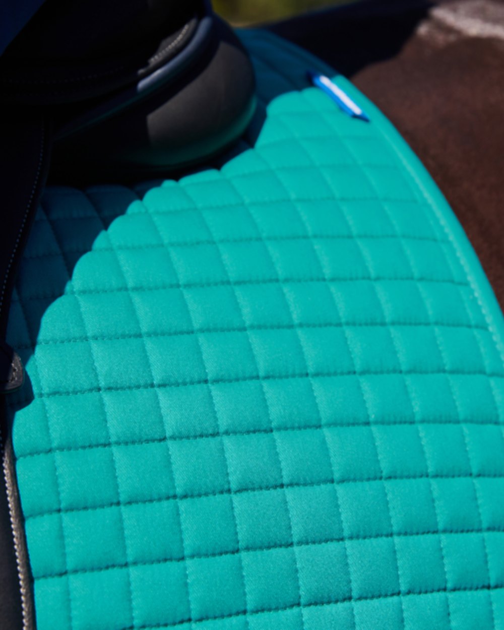 Dark Turquoise Coloured WeatherBeeta Prime Air-Tec All Purpose Saddle Pad on horse background