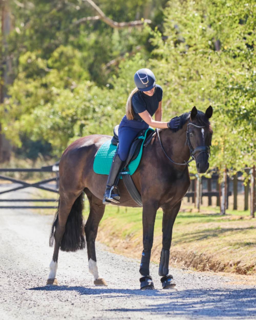 Dark Turquoise Coloured WeatherBeeta Prime Air-Tec All Purpose Saddle Pad on horse background