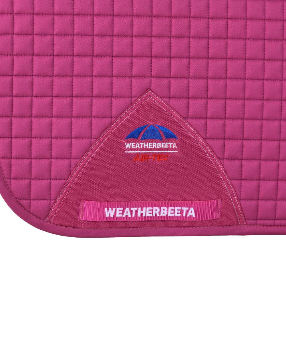 Bright Magenta Coloured WeatherBeeta Prime Air-Tec Dressage Saddle Pad on white background