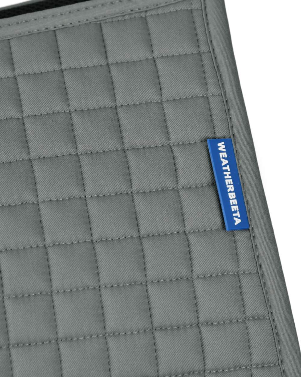 Grey Coloured WeatherBeeta Prime Air-Tec Jump Shaped Saddle Pad on white background