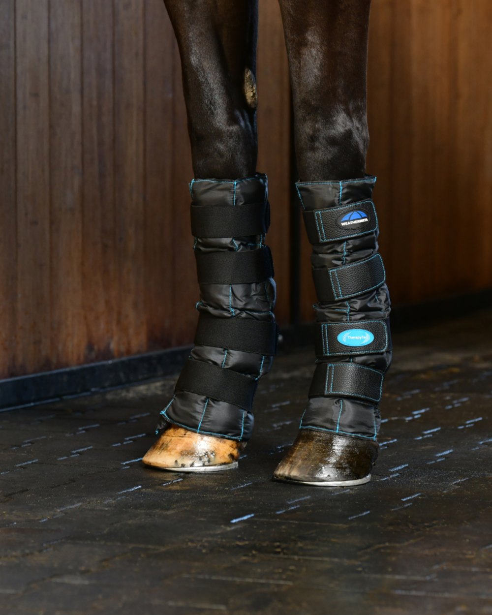 Black Coloured WeatherBeeta Therapy-Tec II Gel Ice Boots on outdoor background
