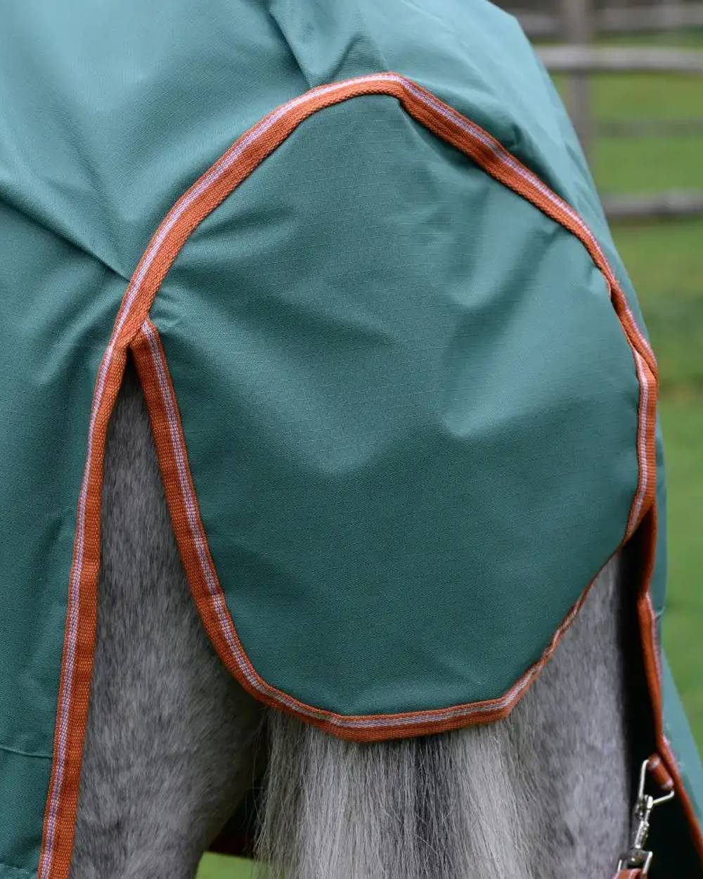 Green Burnt Orange White coloured Weatherbeeta ComFiTec Tyro Standard Neck Medium on blurry background