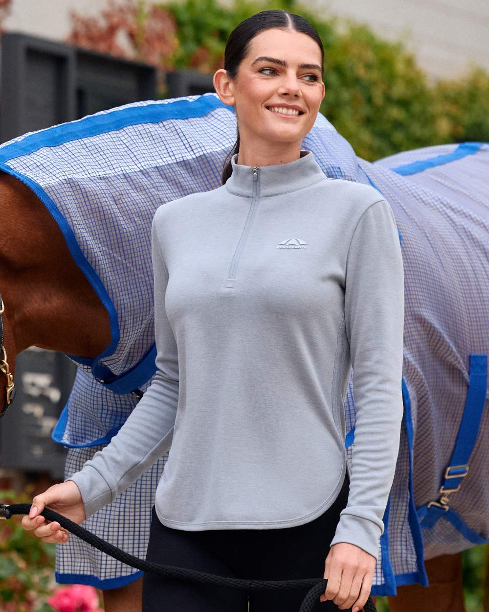 Bluestone Marle coloured Weatherbeeta Womens London Layer Long Sleeve Top on outdoor background