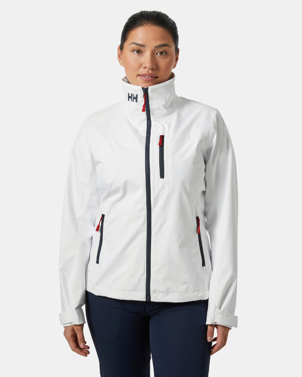 White coloured Helly Hansen Womens Crew Sailing Jacket 2.0 on grey background