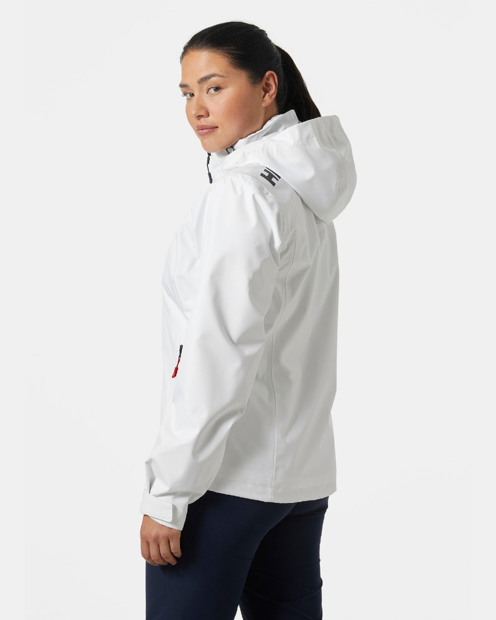 White coloured Helly Hansen womens crew hooded sailing jacket 2.0 on grey background 