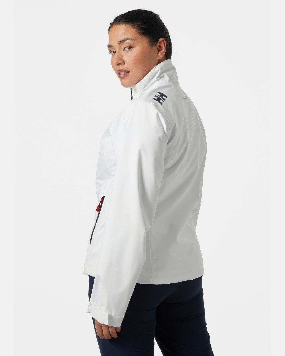 White coloured Helly Hansen Womens Crew Sailing Jacket 2.0 on grey background