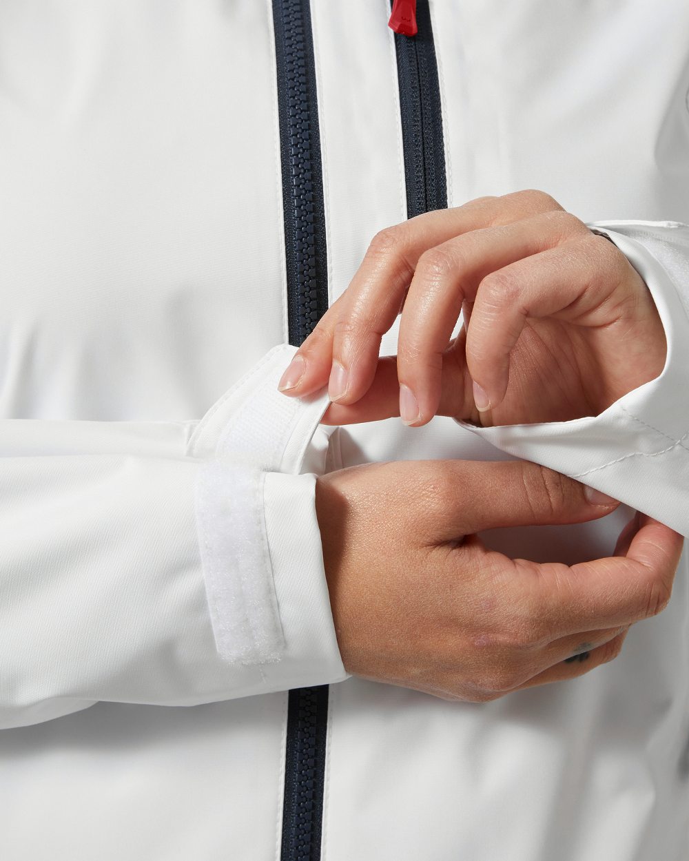 White coloured Helly Hansen Womens Crew Sailing Jacket 2.0 on white background