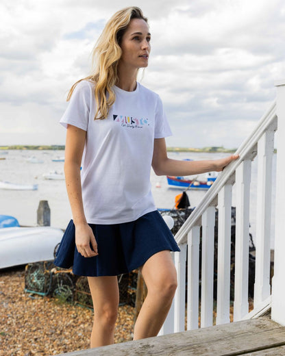 White Coloured Musto Womens 1964 Short Sleeve T-Shirt On A Sea Background 