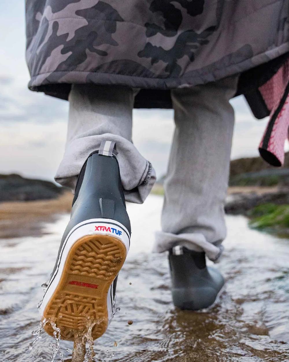 Black Coloured Xtratuf Mens 6 Ankle Deck Boots on outdoor background