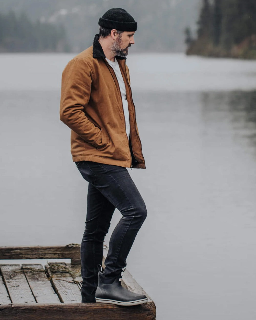 Black Coloured Xtratuf Mens Trolling Pack Fleece Lined Ankle Deck Boots on outdoor background