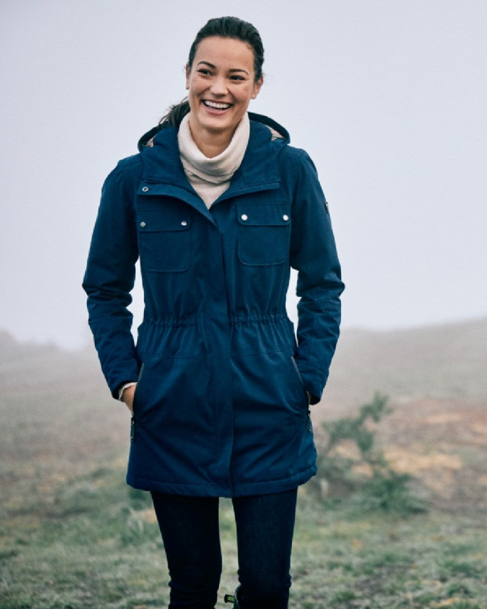Navy Coloured Ariat Womens Argentium Waterproof Parka On A Forest Background