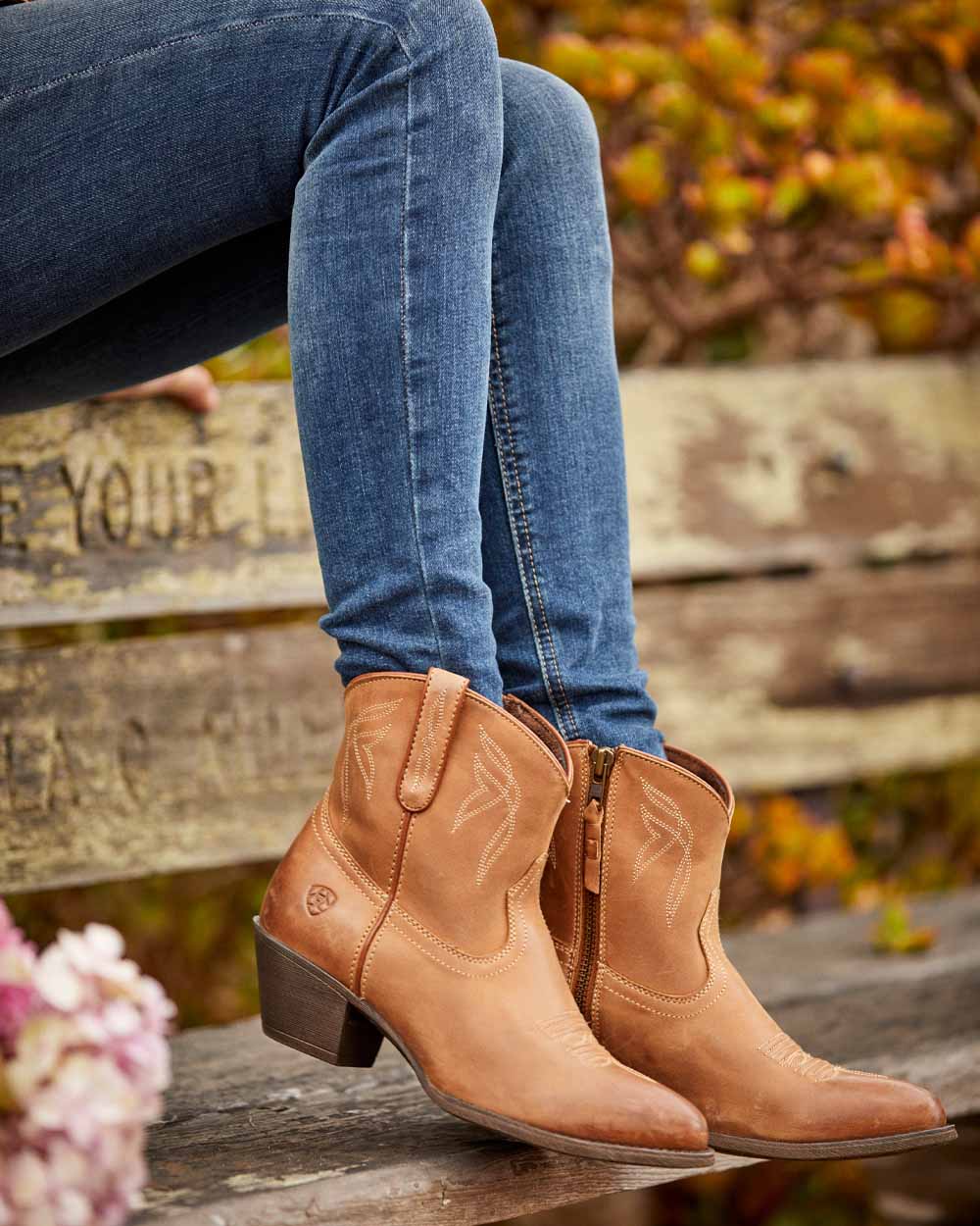 Burnt Sugar coloured Ariat Womens Darlin Western Boot on Park Bench background