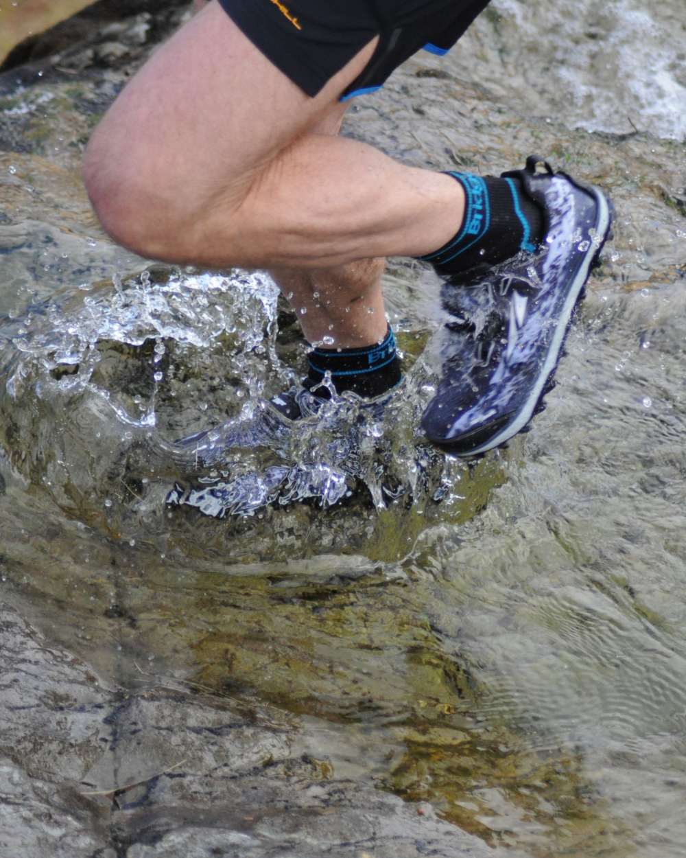 Black Coloured Bridgedale StormSock Midweight Ankle Socks on Outdoor Background