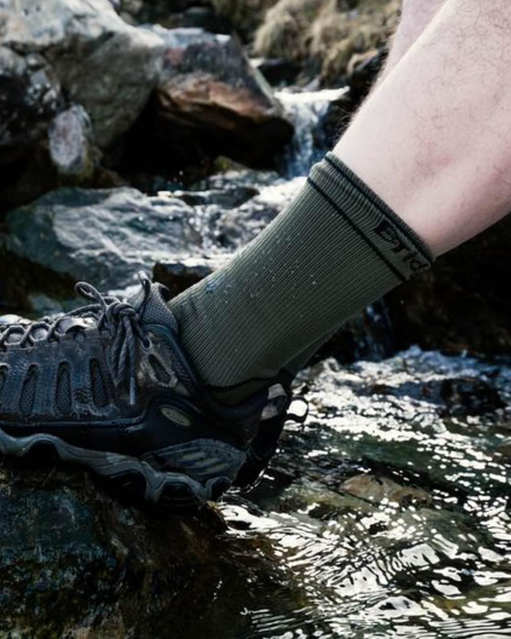 Khaki Coloured Bridgedale StormSock Midweight Boot Socks on Outdoor Background