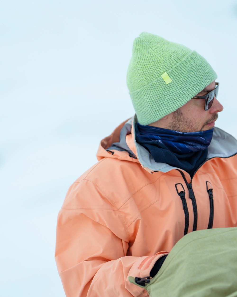 Opaline Coloured Buff Knitted Marin Beanie on snow background