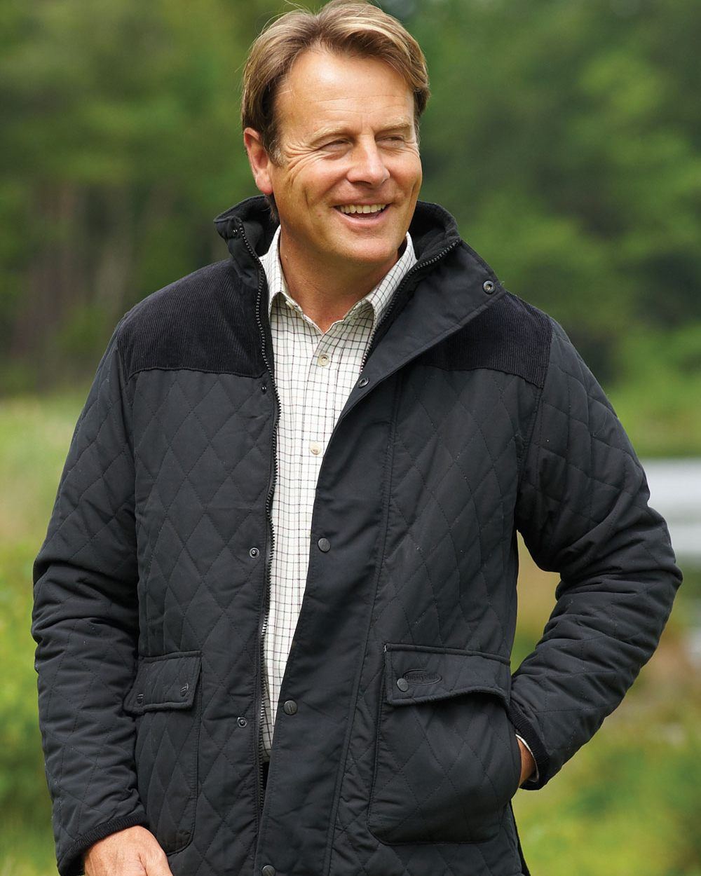 Black Coloured Champion Lewis Diamond Quilted Jacket On A Lake Background