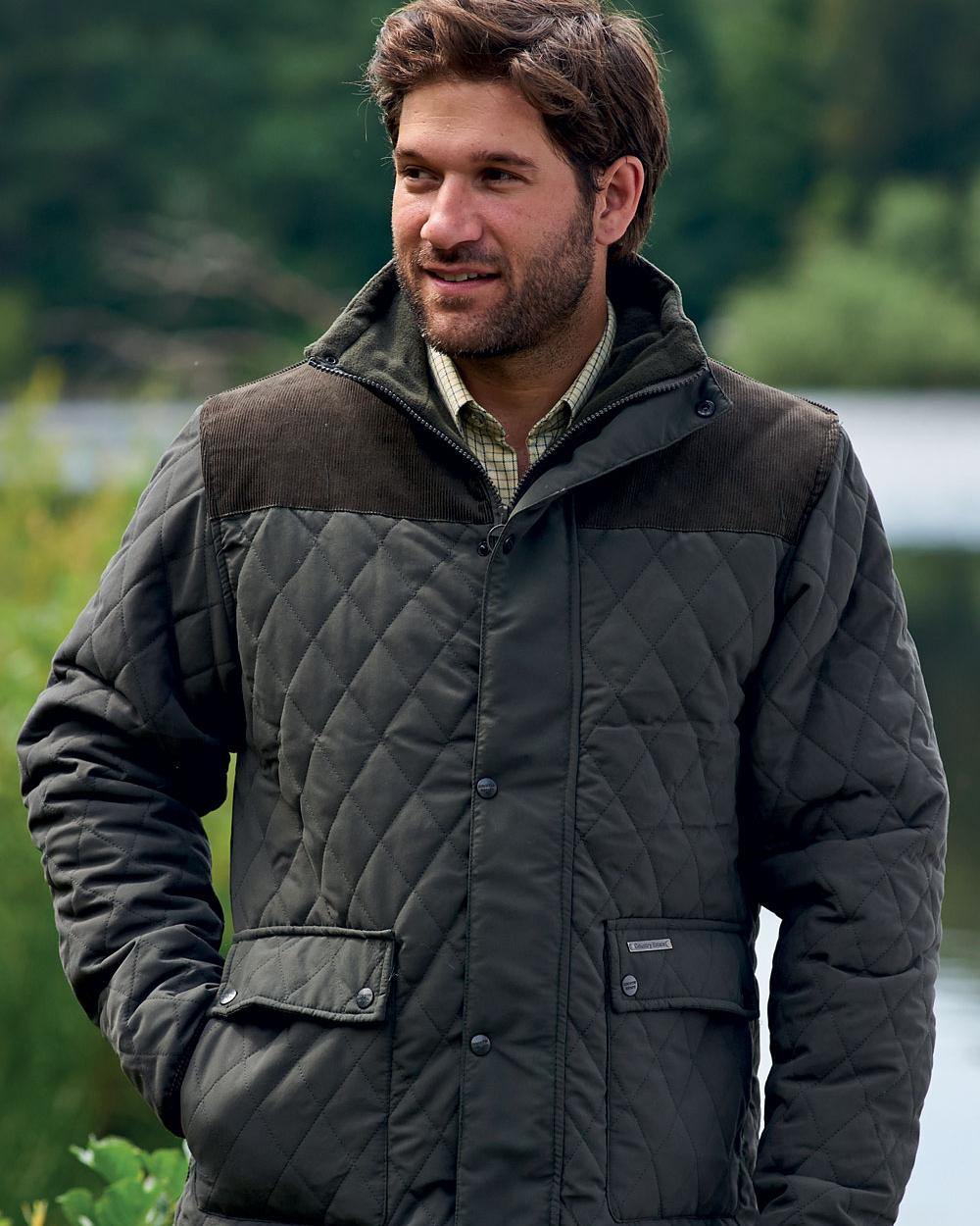 Olive Coloured Champion Lewis Diamond Quilted Jacket On A Lake Background