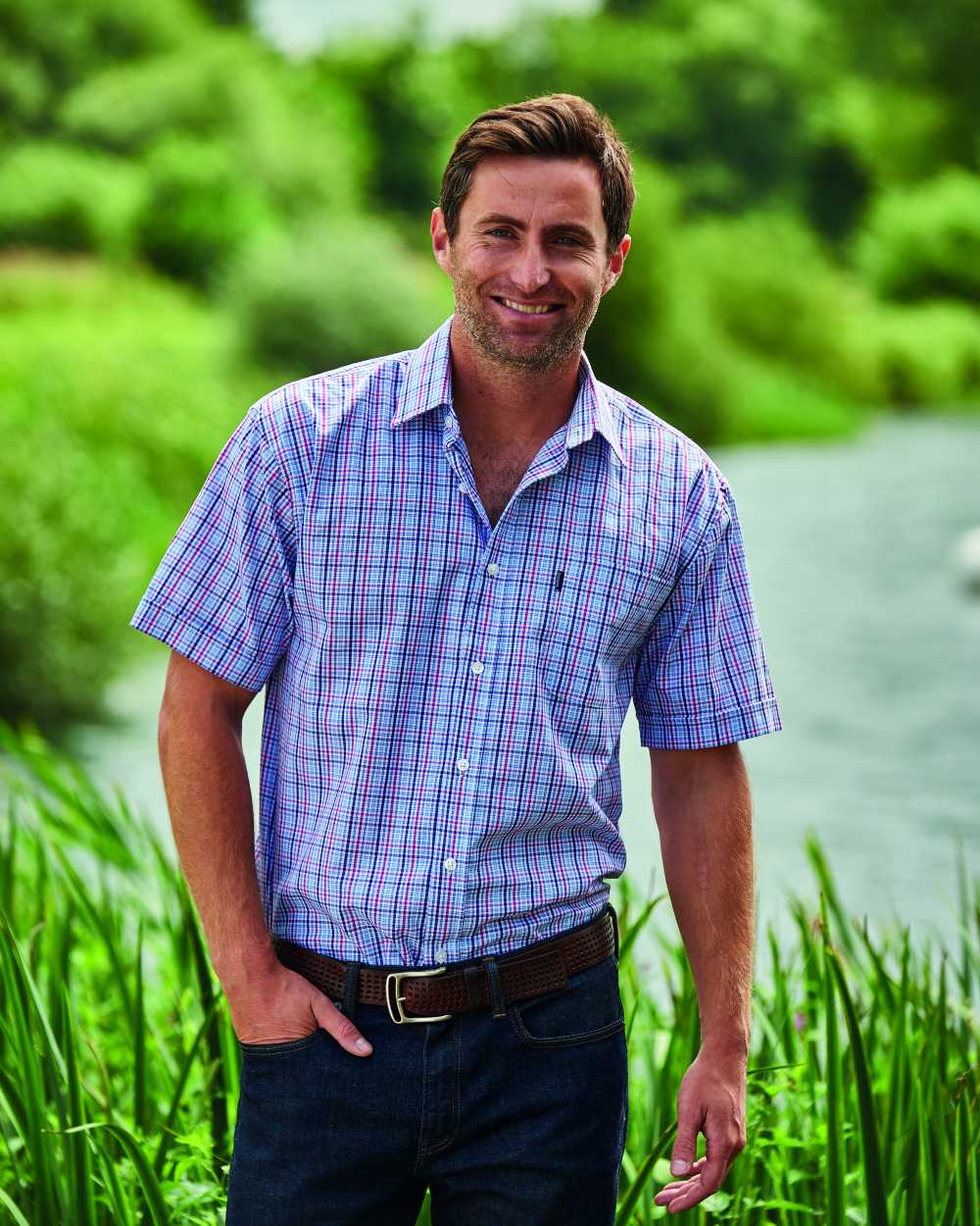 Red Coloured Champion Poole Short Sleeve Shirt On A Lake Background