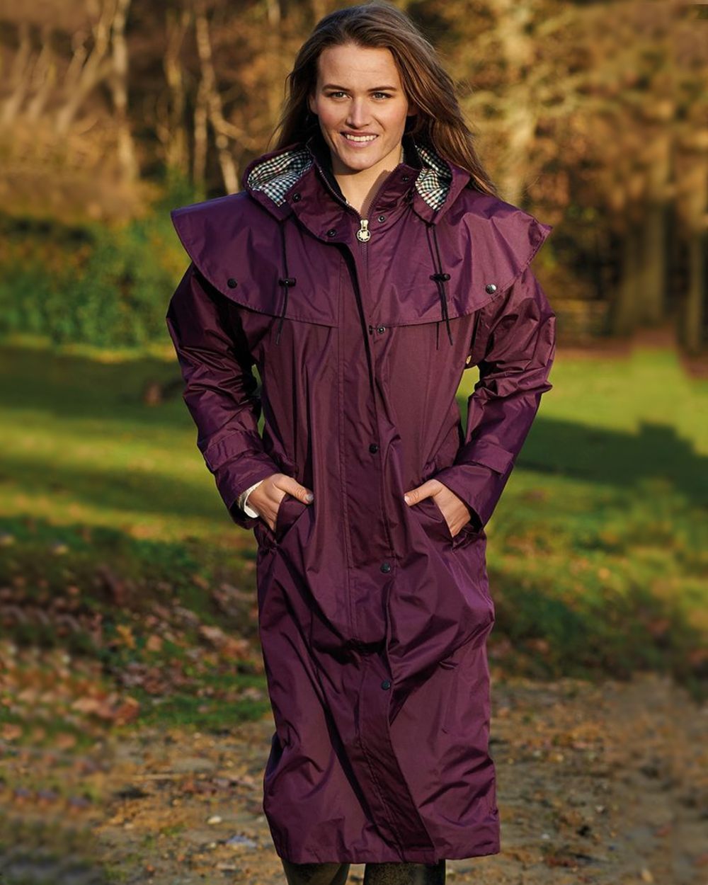 Plum Coloured Champion Sandringham Long Waterproof Coat On A Forest Background