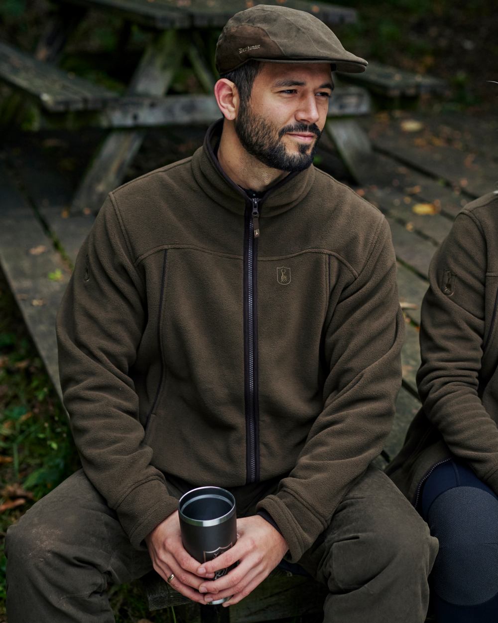 Tarmac Green Coloured Deerhunter Eagle Fleece Jacket On A Forest Background