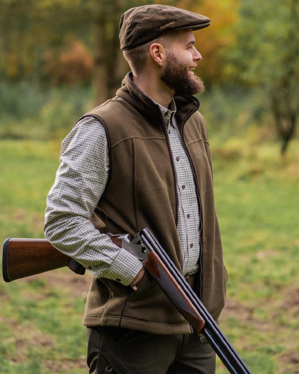 Tarmac Green Coloured Deerhunter Eagle Fleece Waistcoat On A Forest Background