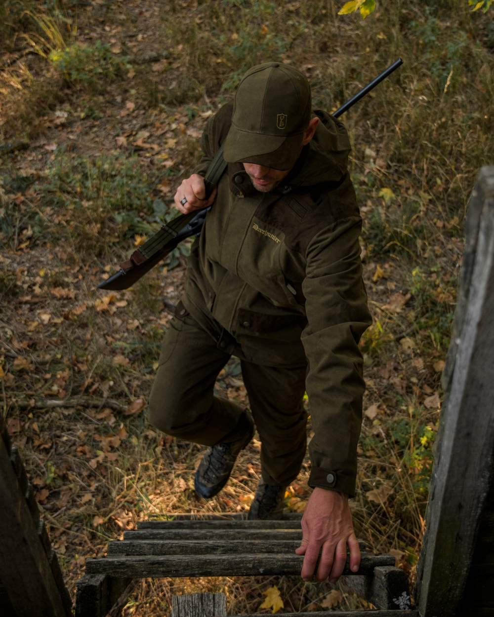 Tarmac Green coloured Deerhunter Eagle Trouser on a forest background