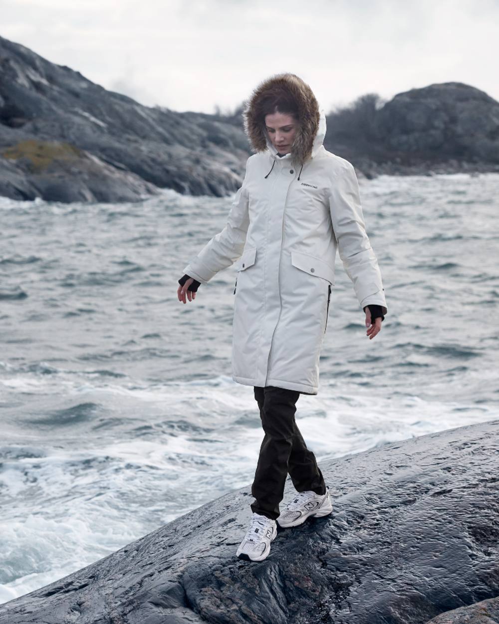White Foam Coloured Didriksons Erika Ladies Padded Waterproof Parka 3 On A Coastal Background