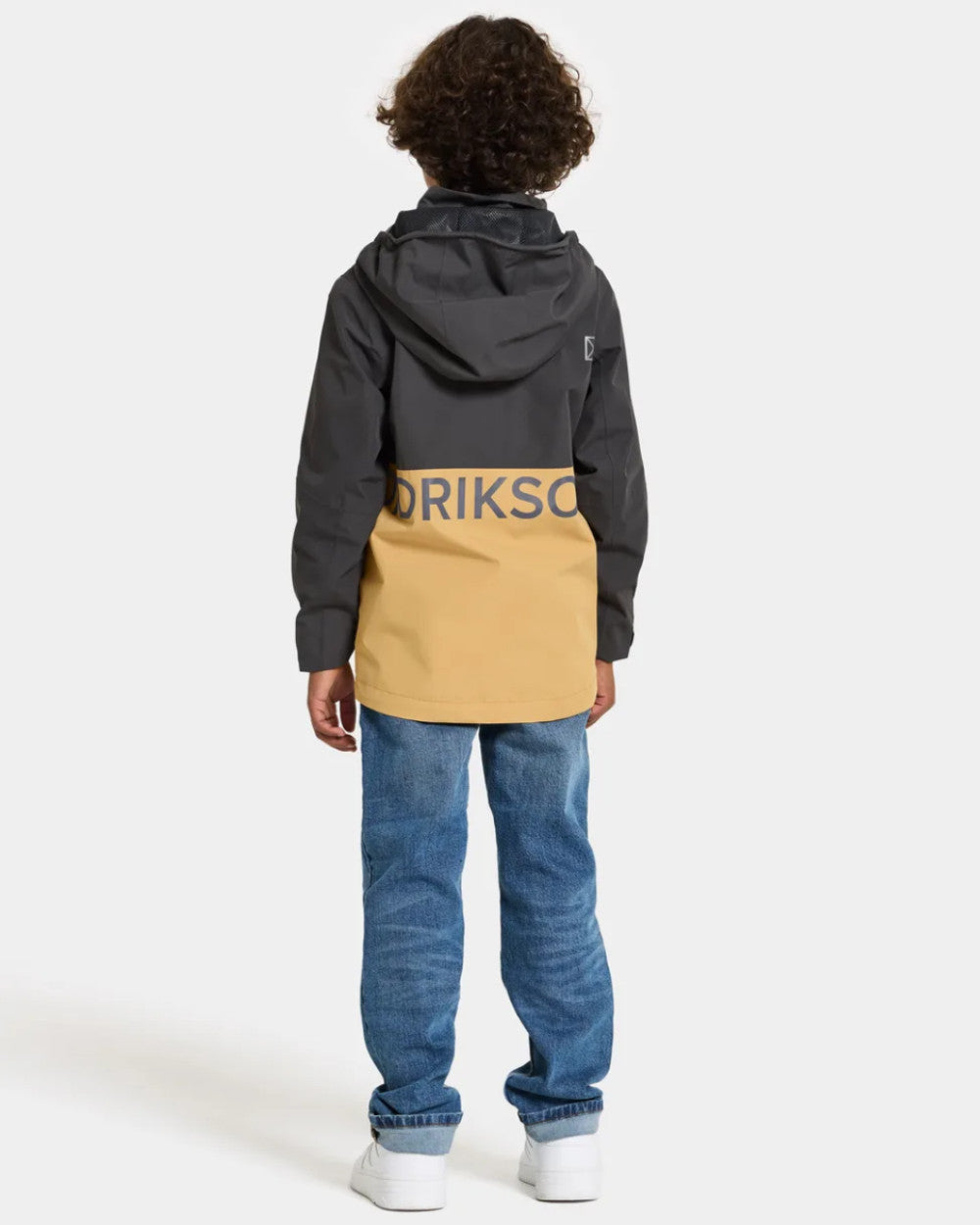 Sanstorm Coloured Didriksons Piko Childrens Jacket On A Grey Background 