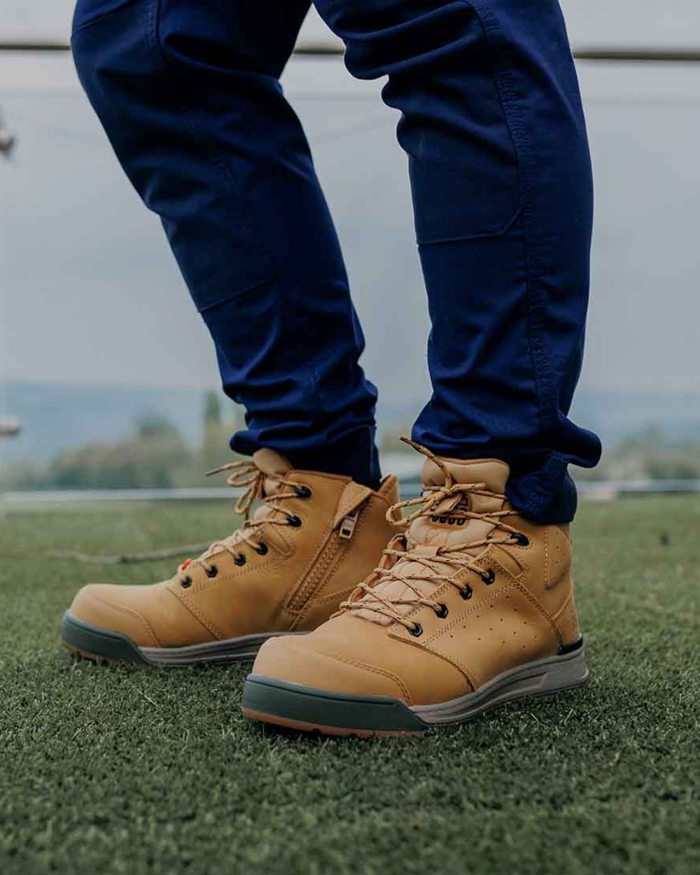Wheat Coloured Hard Yakka Mens 3056 Lace Zip Safety Boots on Outdoor Background